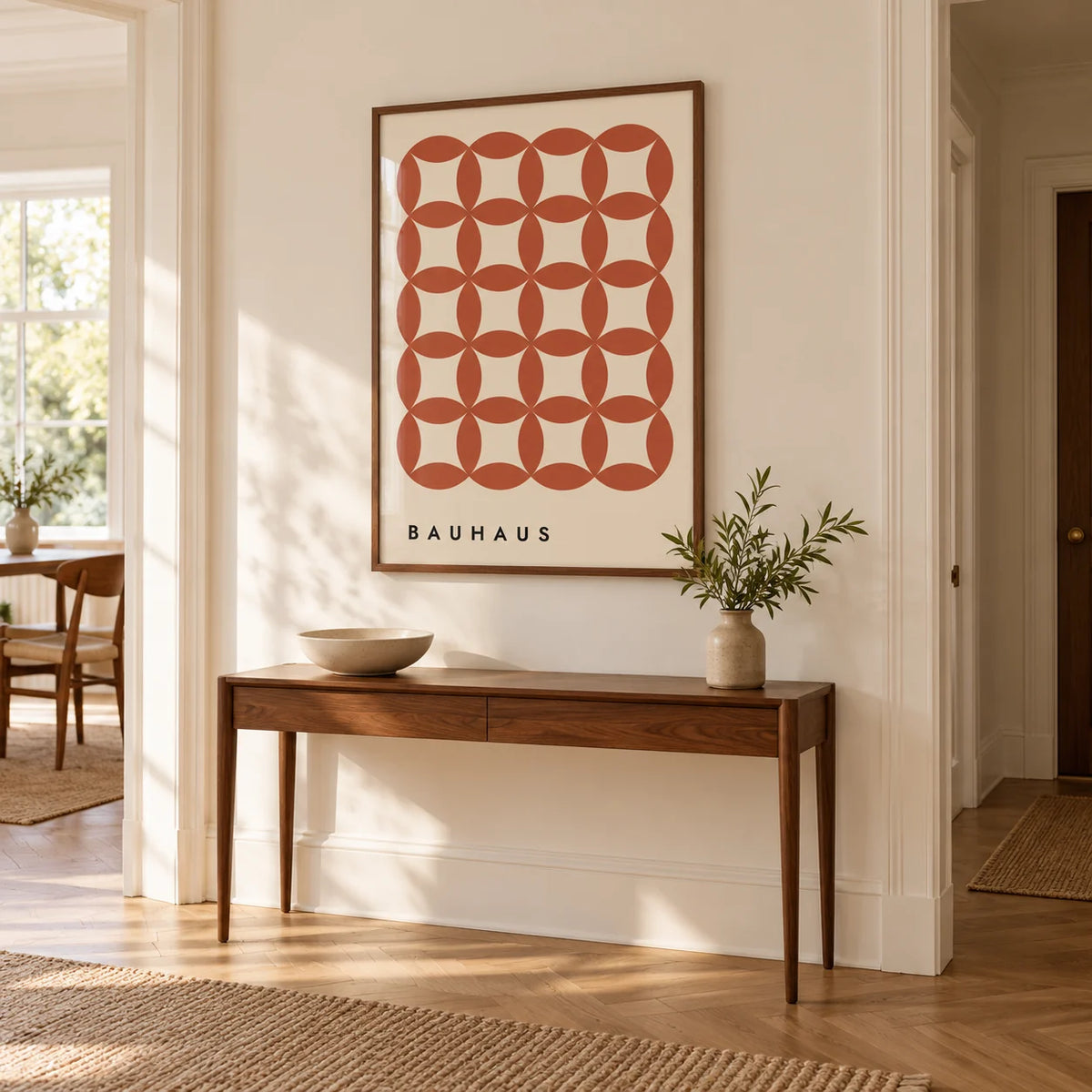 Geometric Wall Hanging, framed on the wall of a hallway with a warm white wall and herringbone oak floor