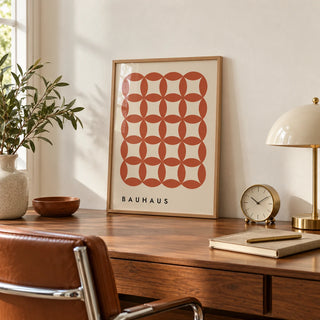 Geometric Wall Hanging, a small A4 framed print leaning on a slim walnut desk
