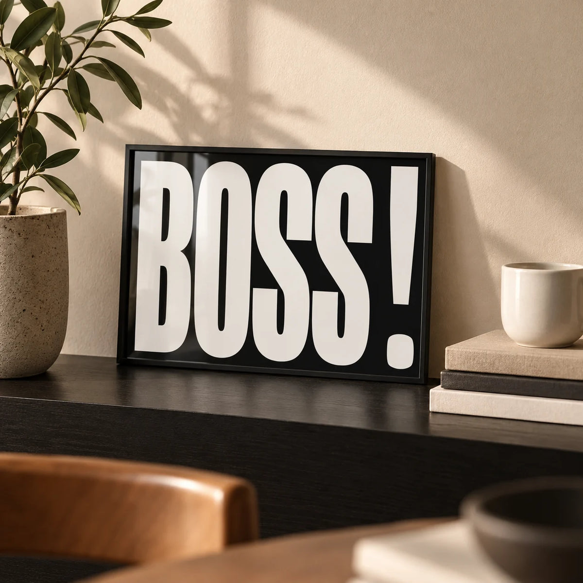Gift for Boss, a small A4 framed print leaning on a black shelf in a living room