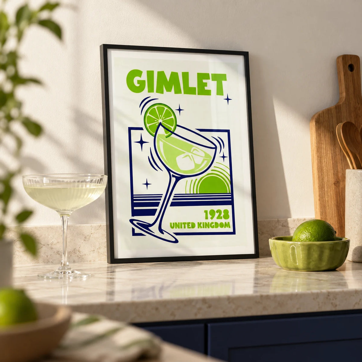 Gimlet Cocktail Poster, a small A4 framed print leaning on an ivory stone kitchen worktop