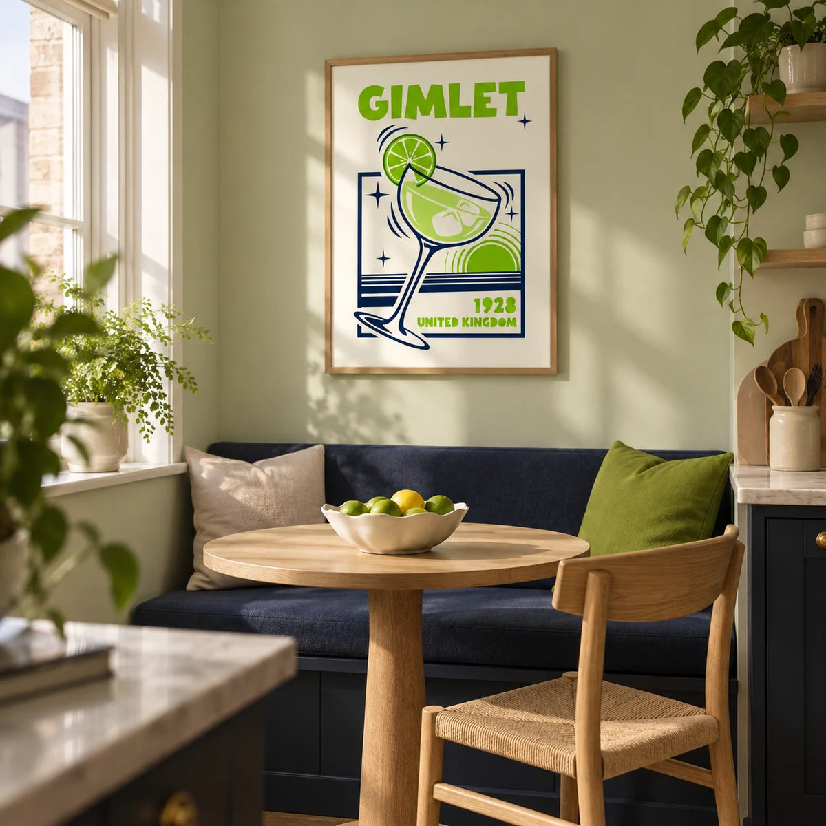 Gimlet Cocktail Poster, framed on the wall of a small kitchen breakfast nook in a first UK flat for a couple aged 25-35 with a pale green wall
