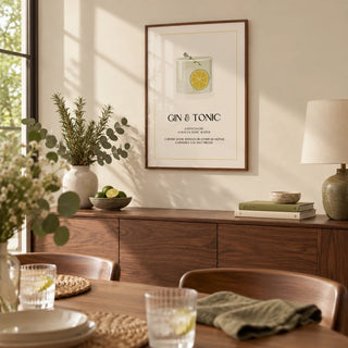 Gin and Tonic Wall Art, framed on the wall of a calm dining room with a warm cream wall