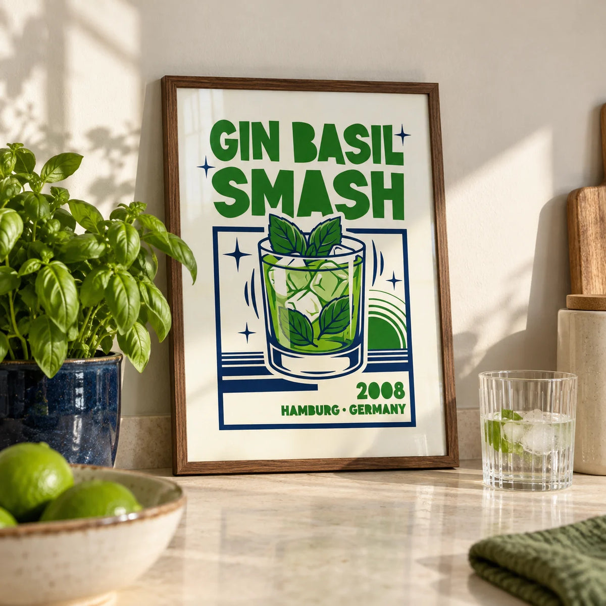 Gin Basil Smash Poster, a small A4 framed print leaning on a pale stone kitchen worktop