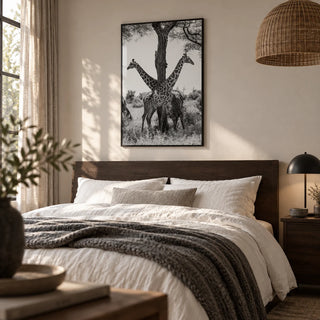 Giraffe Black And White Art Print, framed on the wall of a calm bedroom