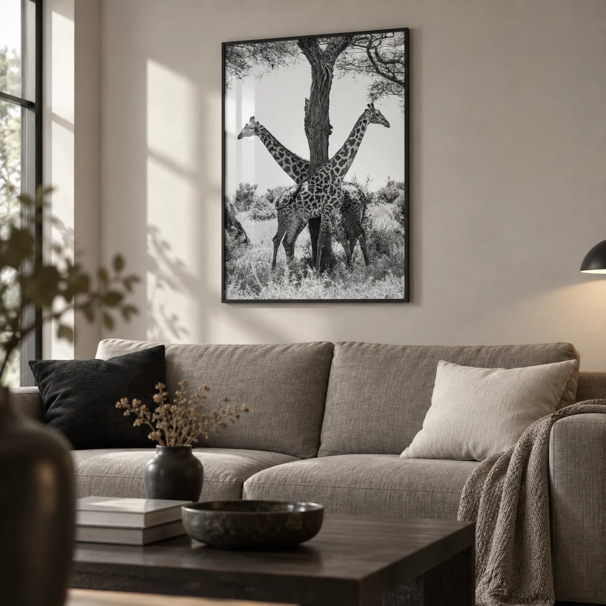 Giraffe Black And White Art Print, framed on the wall of a calm monochrome living room