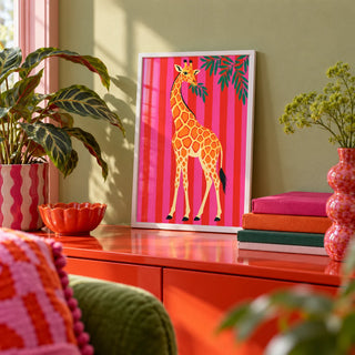 Giraffe Wall Art, a small A4 framed print leaning on a colourful lacquered shelf in a living room