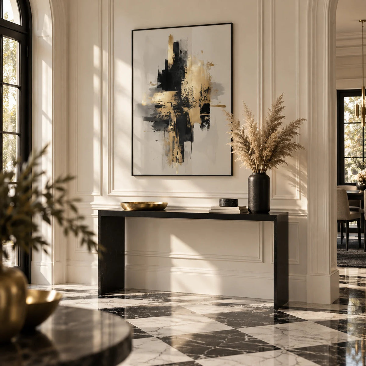 Gold Wabi Sabi Print, framed on the wall of a grand entrance hall with a warm white panelled wall and a black and white marble floor