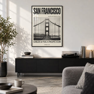 Golden Gate Bridge Art Print, framed on the wall of a modern city-flat living room with a white wall and a concrete floor