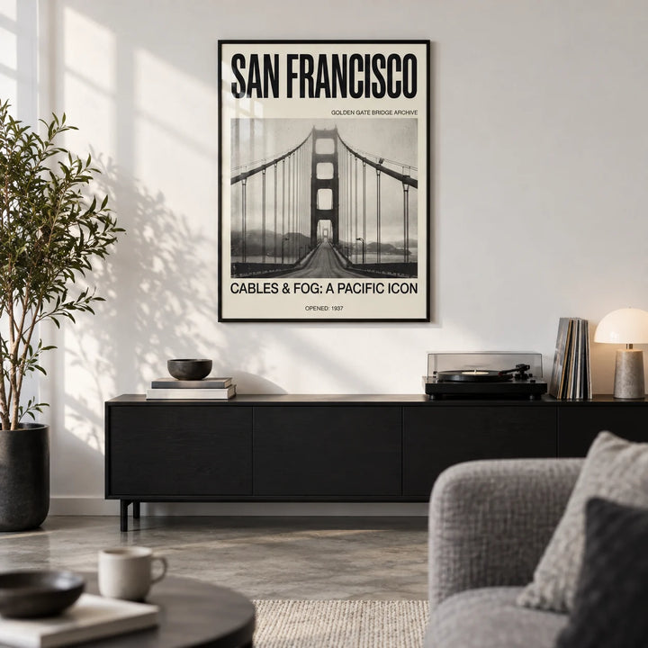 Golden Gate Bridge Art Print, framed on the wall of a modern city-flat living room with a white wall and a concrete floor