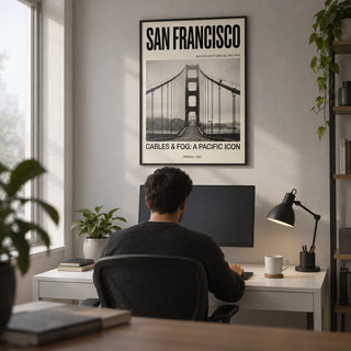 Golden Gate Bridge Art Print, framed on the wall of a tech worker's home office with a light grey wall