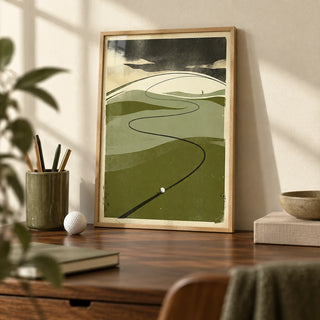 Golf Course Art Print, a small A4 framed print leaning on a walnut desk