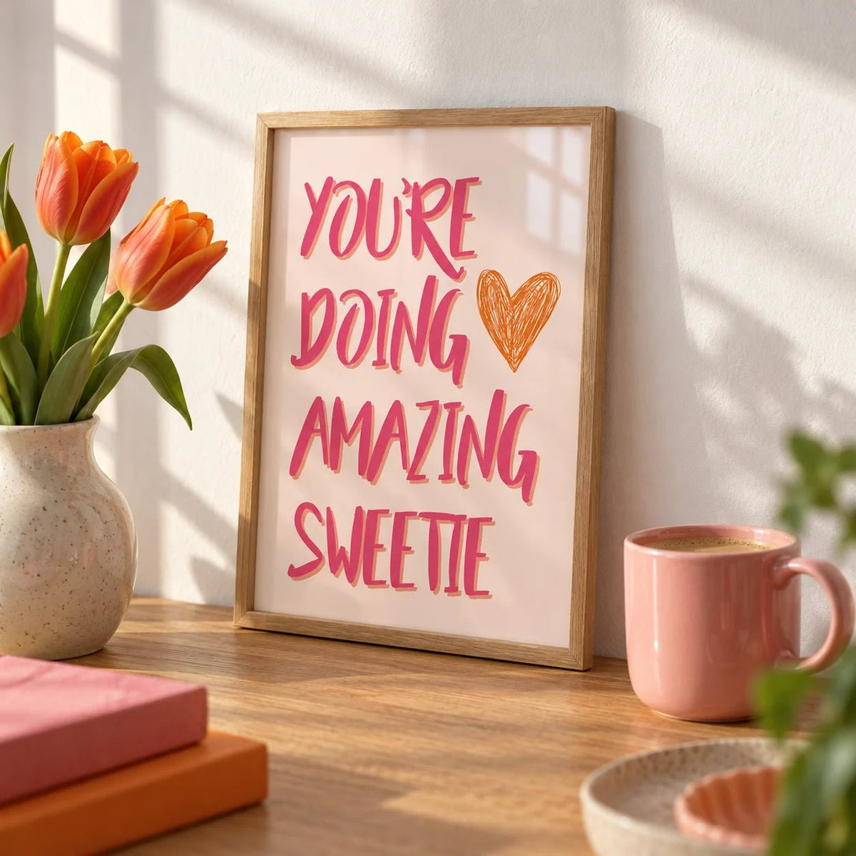 Good Motivational Posters, a small A4 framed print leaning on an oak desk