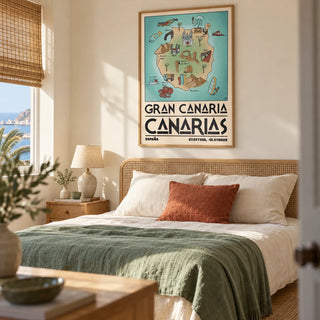 Gran Canaria Art Print, framed on the wall of a sunny adult bedroom in a UK seaside home with warm ivory walls and a simple cane headboard