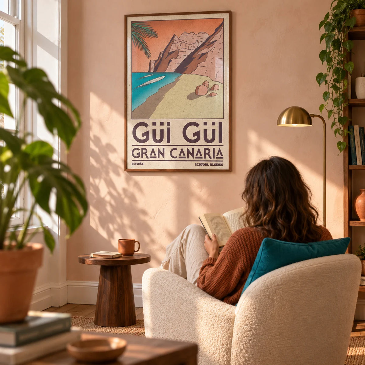 Gran Canaria Beach Art Print, framed on the wall of a sunlit reading corner in a characterful UK flat with a pale peach plaster wall in a living room