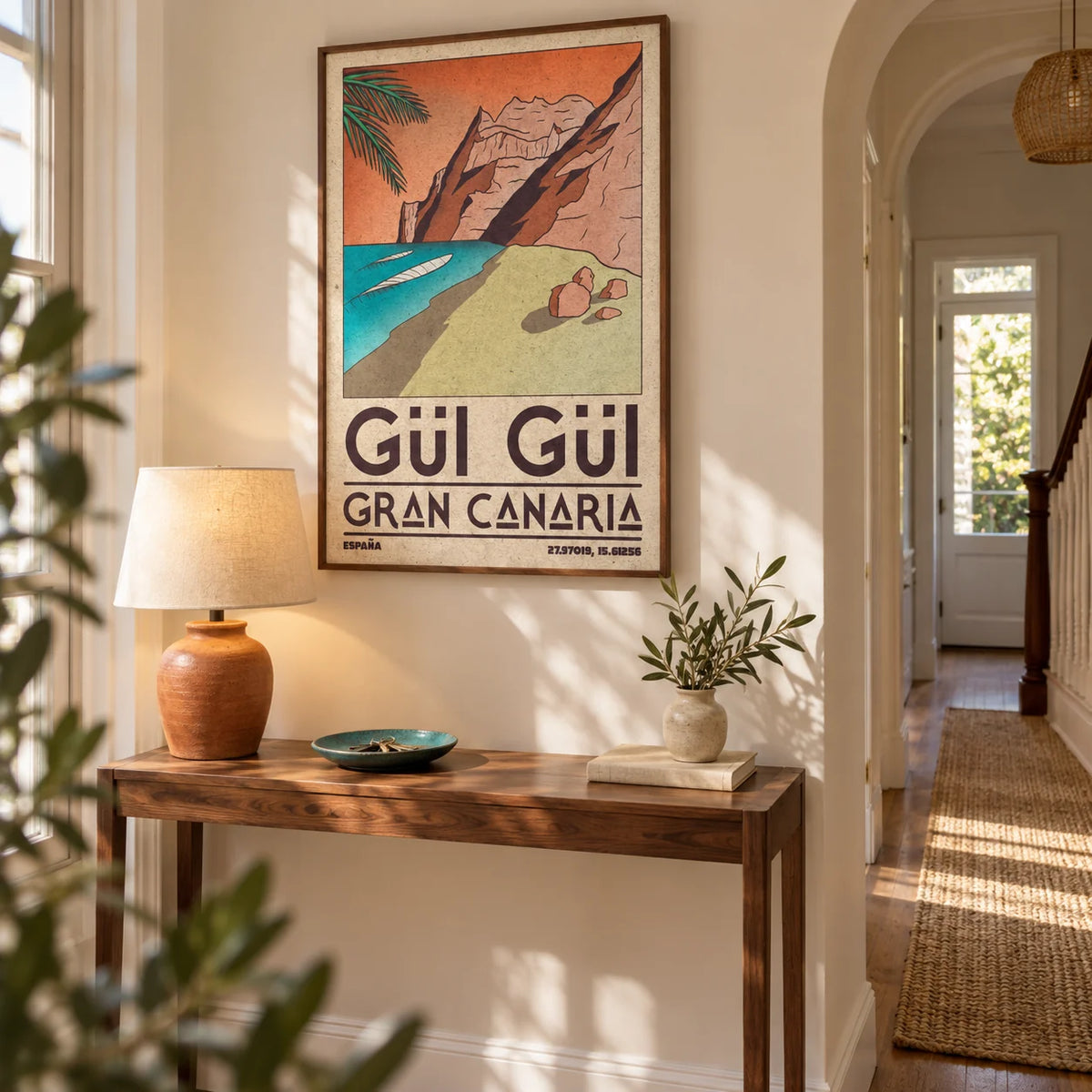 Gran Canaria Beach Art Print, framed on the wall of a welcoming hallway in a renovated British terrace with soft cream walls and warm wood flooring