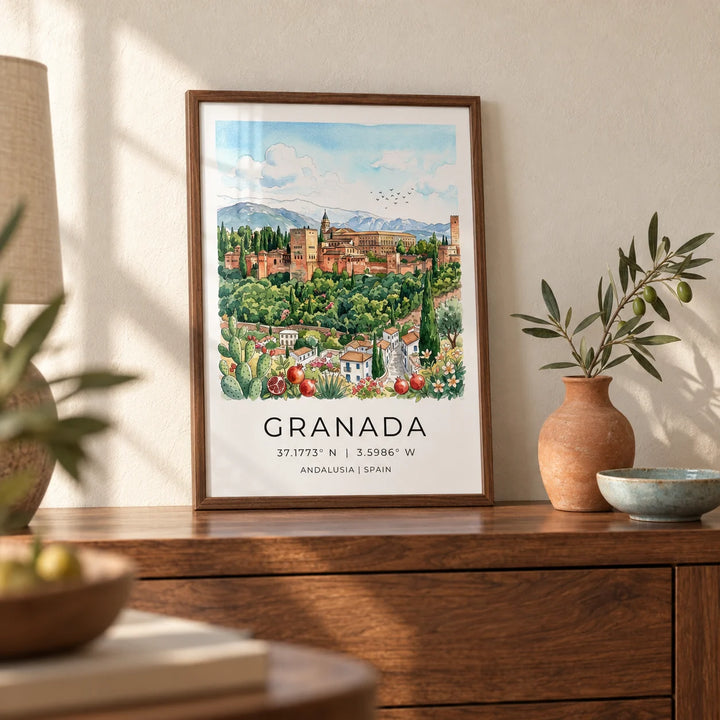 Granada Spain Art Print, a small A4 framed print leaning on a walnut side table in a hallway
