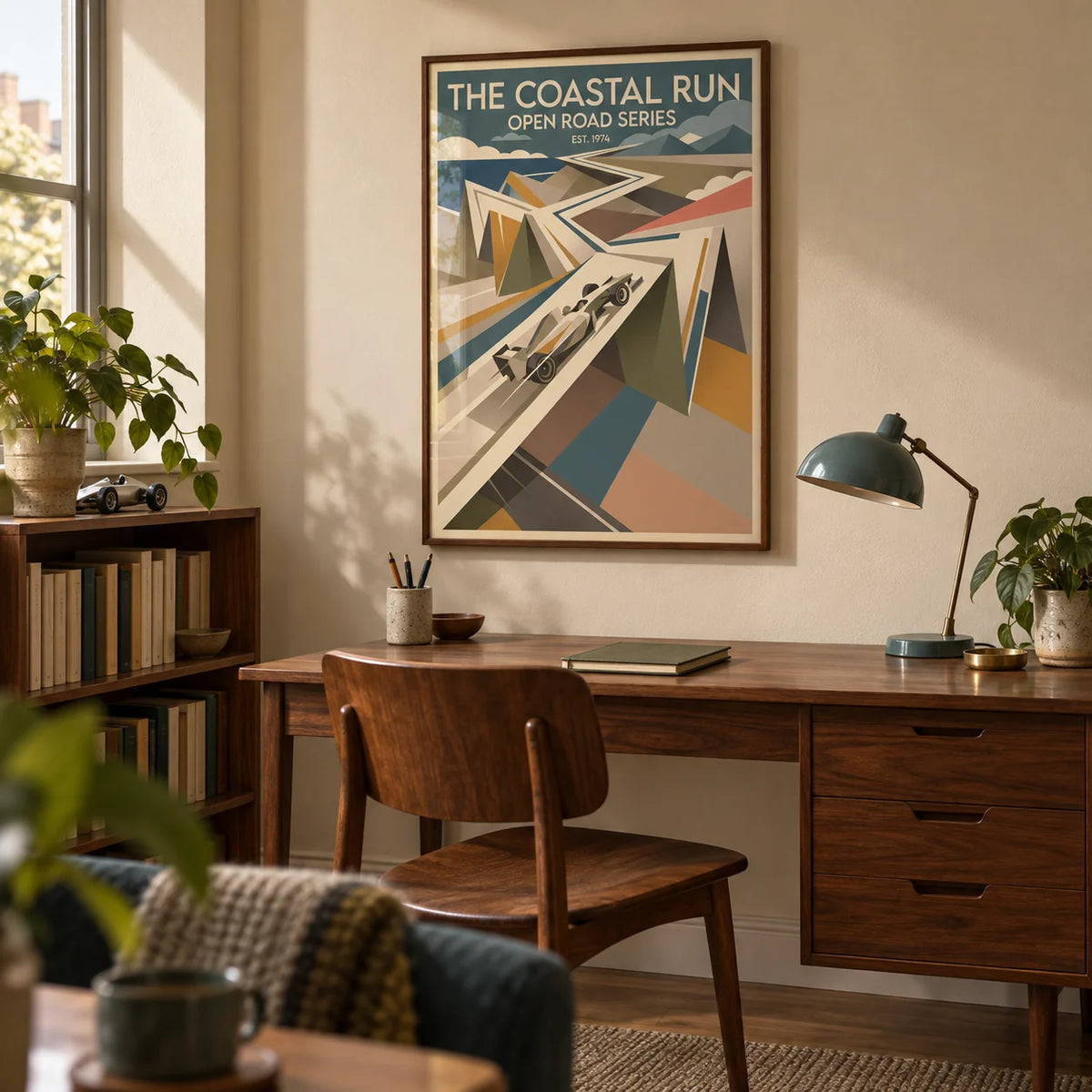 Grand Prix Race Poster, framed on the wall of a mid-century home study in a UK flat with a pale sand wall and walnut furniture