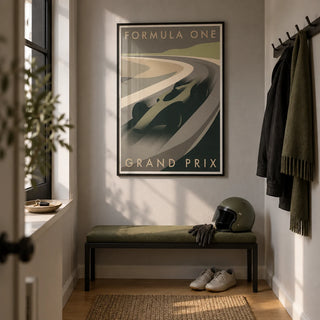 Grand Prix Racing Print, framed on the wall of a narrow entrance hallway in a young motorsport enthusiast's UK flat with a pale grey wall and warm oak flooring