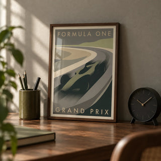 Grand Prix Racing Print, a small A4 framed print leaning on a walnut desk