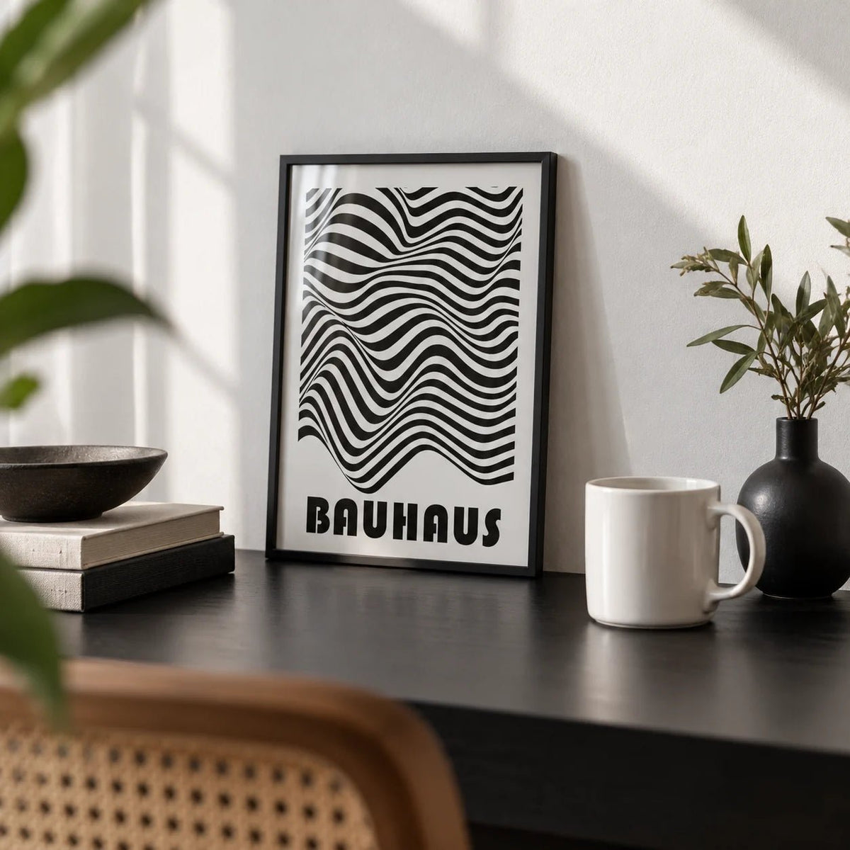 Graphic Art Print, a small A4 framed print leaning on a black desk