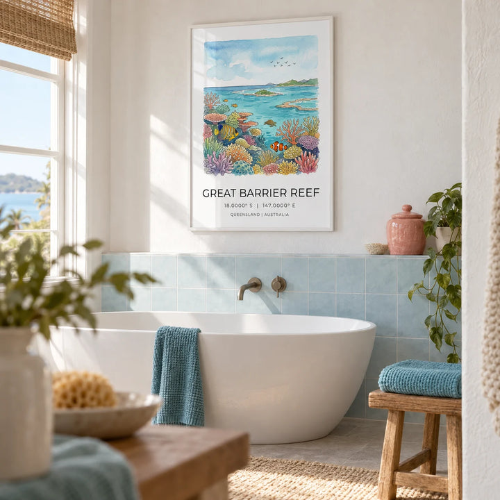 Great Barrier Reef Art Print, framed on the wall of a light bathroom in a renovated coastal cottage with white plaster walls above plain pale blue tiles
