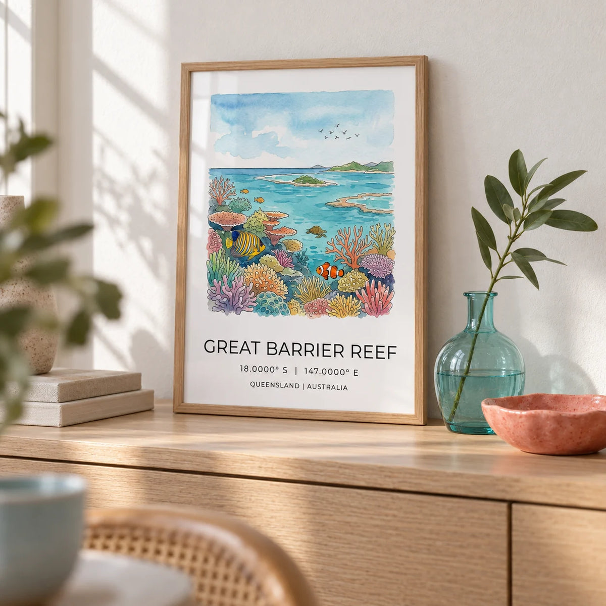 Great Barrier Reef Art Print, a small A4 framed print leaning on a pale oak sideboard in a living room
