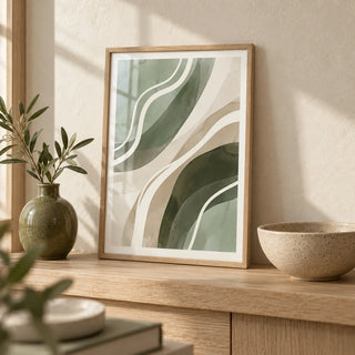 Green Abstract Print, a small A4 framed print leaning on a pale oak shelf in a living room