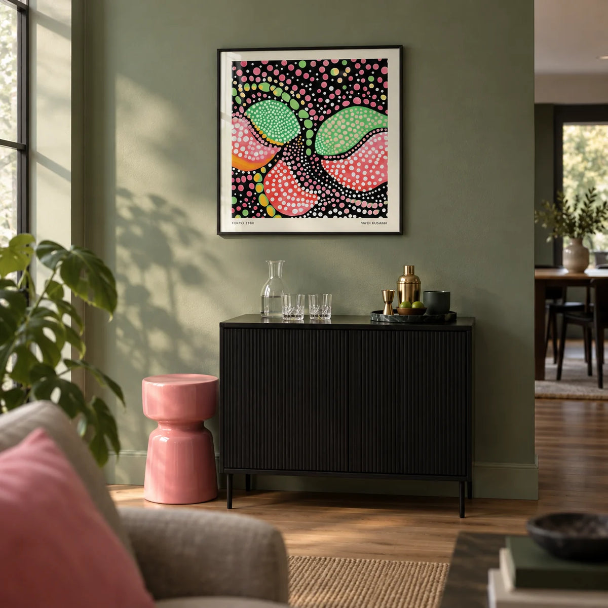 Green Pink Art, framed on the wall of a modern home bar corner in an open-plan living room with a muted green wall