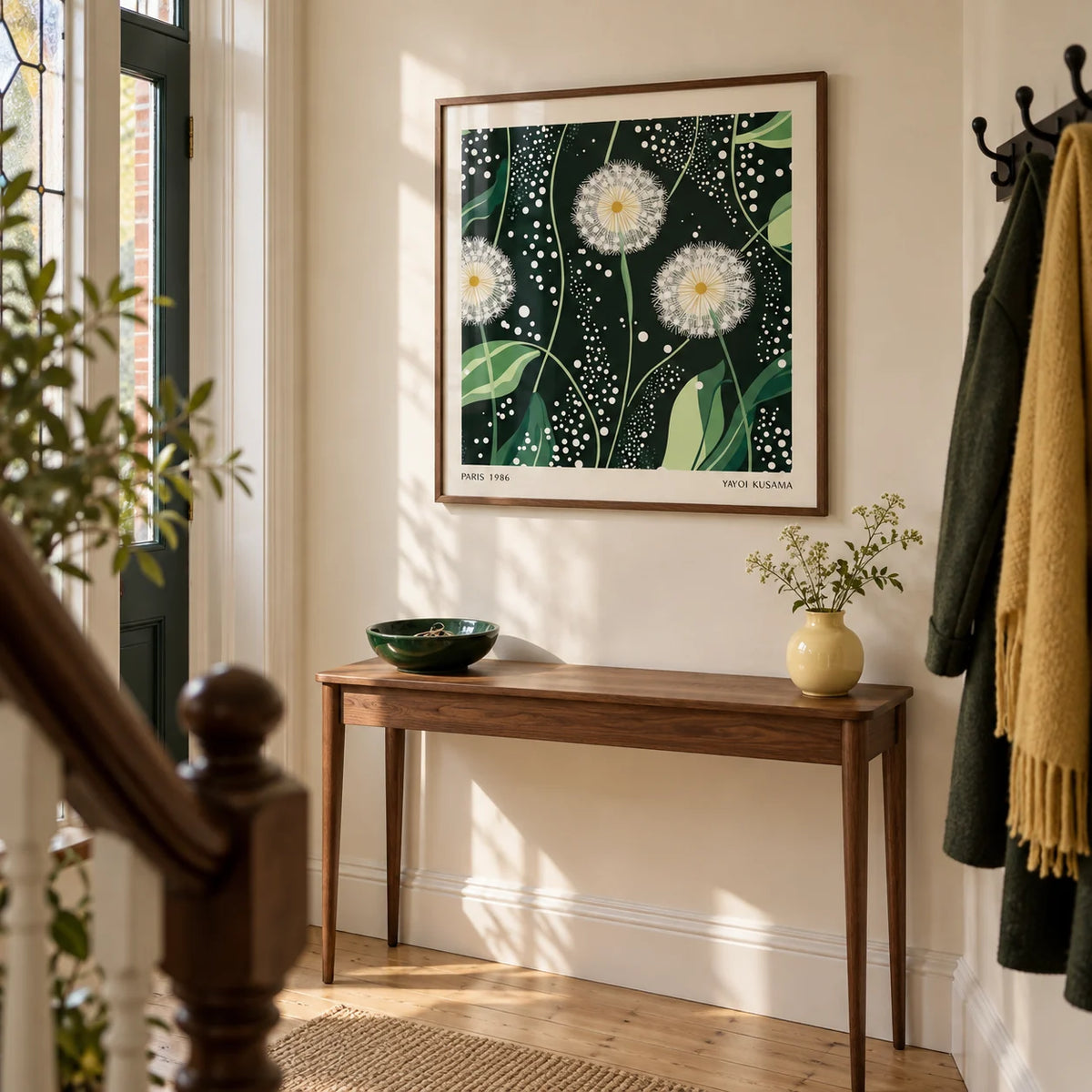 Green Wall Decor, framed on the wall of a welcoming hallway in a UK Victorian terrace with a pale cream wall and simple oak floorboards
