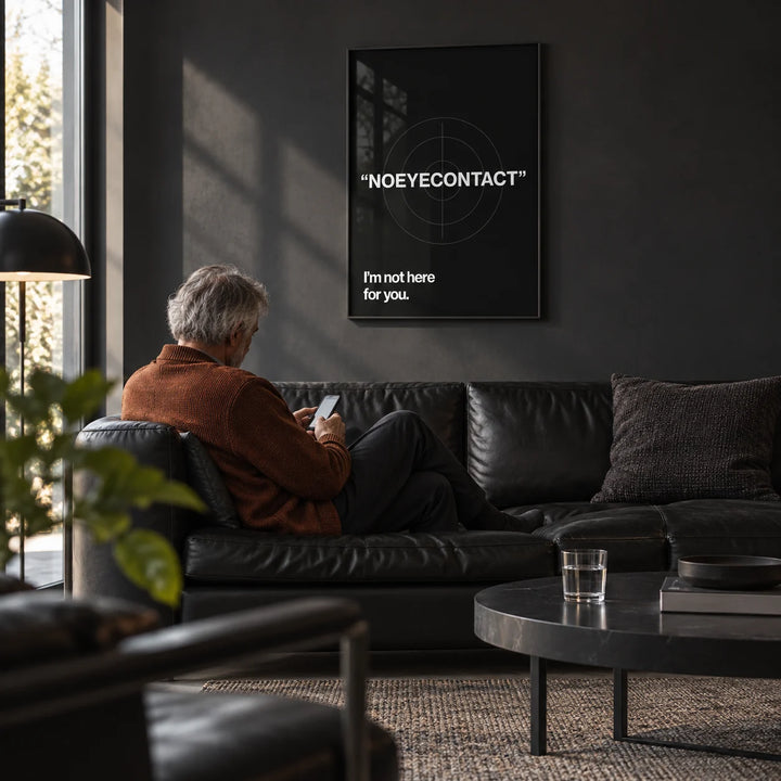 Gym Art, framed on the wall of a dark modern den with a charcoal painted wall and a concrete floor in a living room