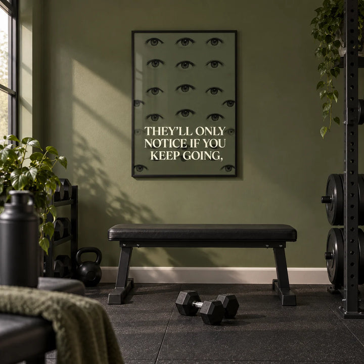 Gym Artwork, framed on the wall of a home gym in a converted spare room with one plain olive green wall and black rubber flooring