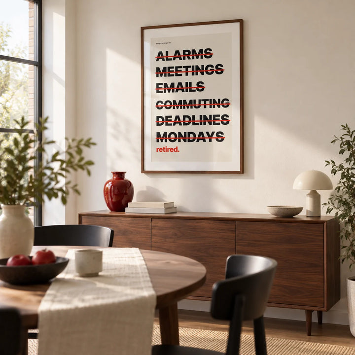 Happy Retirement Poster, framed on the wall of a modern dining room in a UK home with a warm white wall and a large side window