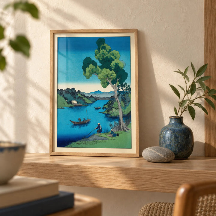 Hasui Kawase Bay Print, a small A4 framed print leaning on a pale oak shelf in a living room