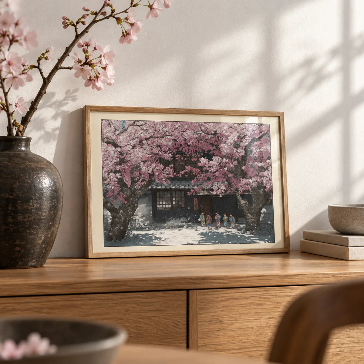 Hasui Kawase Cherry Blossoms, a small A4 framed print leaning on an oak sideboard in a living room