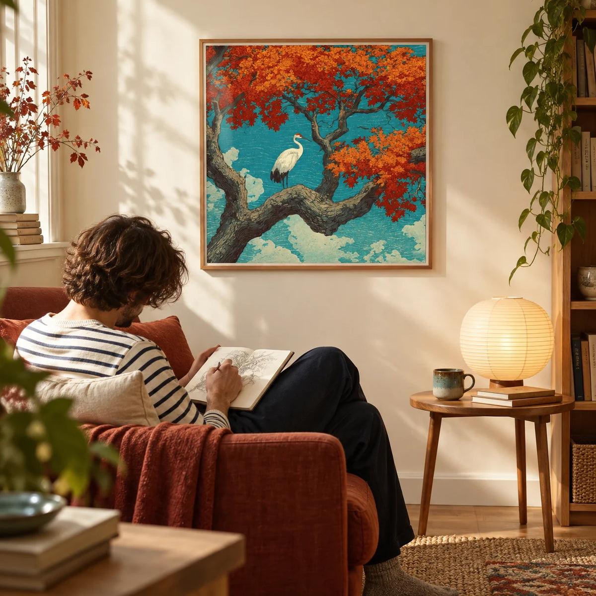 Hasui Kawase Crane Print, framed on the wall of a reading corner in a calm flat with a warm cream wall in a living room