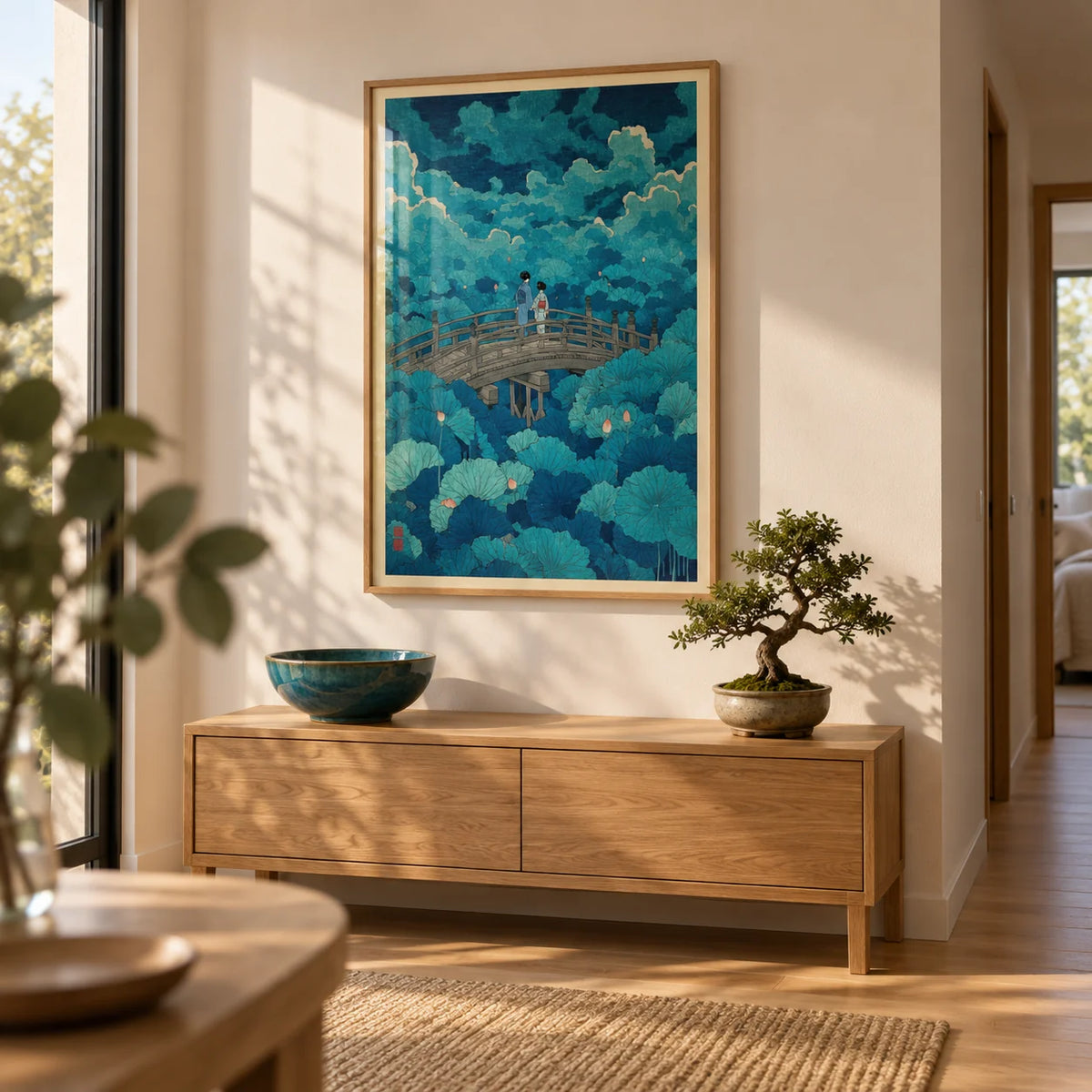 Hasui Kawase Lotus Pond Print, framed on the wall of a calm hallway with a warm white wall and a light oak floor