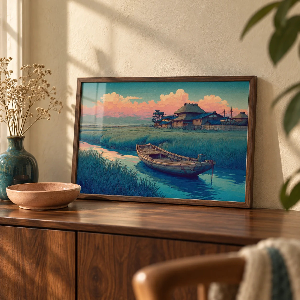 Hasui Kawase River Boat, a small A4 framed print leaning on a walnut sideboard in a living room