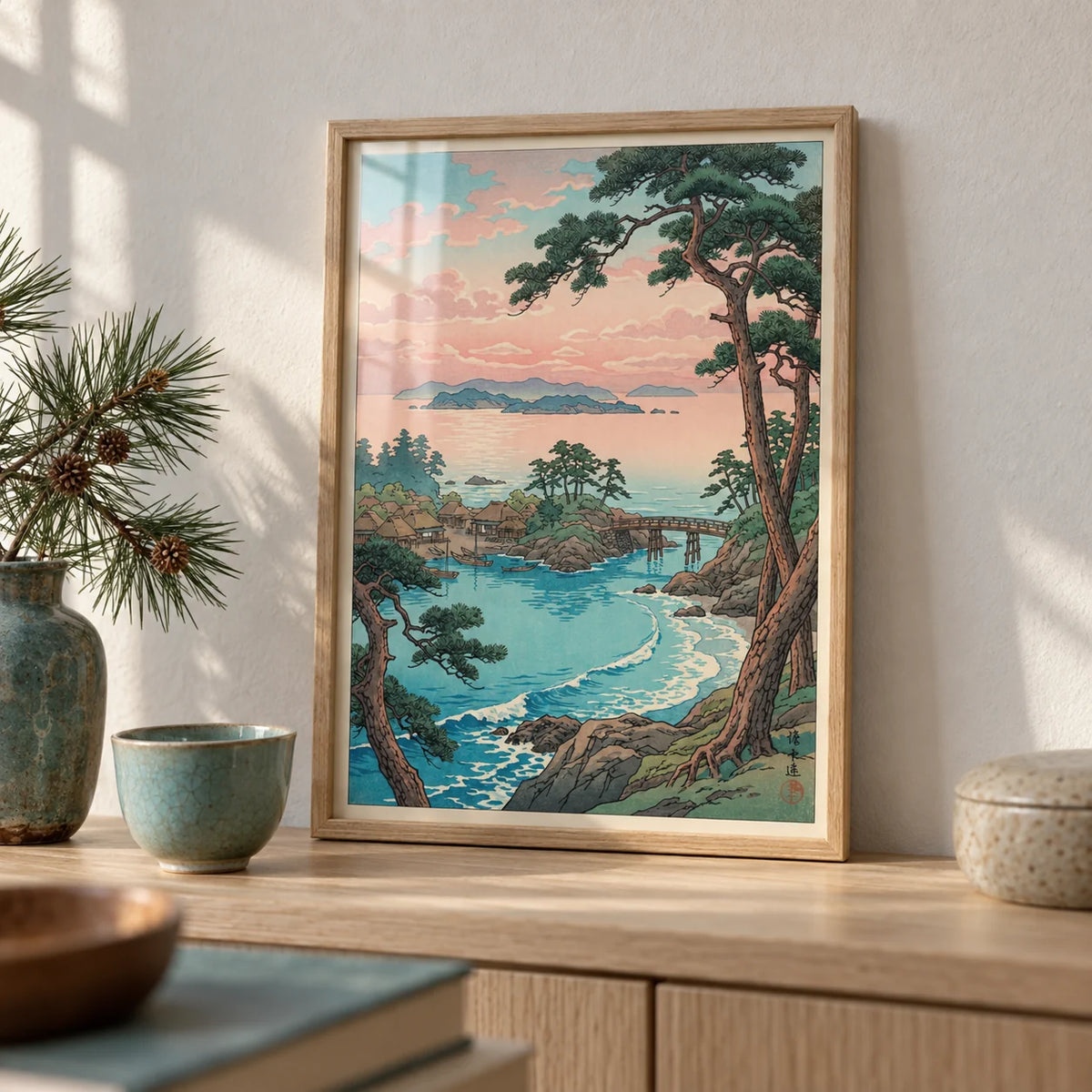 Hasui Kawase Sea Landscape Print, a small A4 framed print leaning on a pale oak shelf in a living room