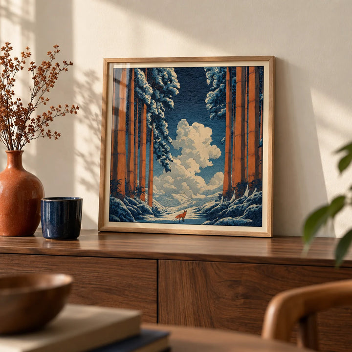 Hasui Kawase Snowy Forest Art Print, a small A4 framed print leaning on a walnut sideboard in a living room
