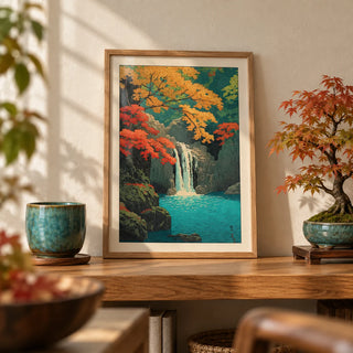 Hasui Kawase Waterfall Print, a small A4 framed print leaning on an oak shelf in a living room
