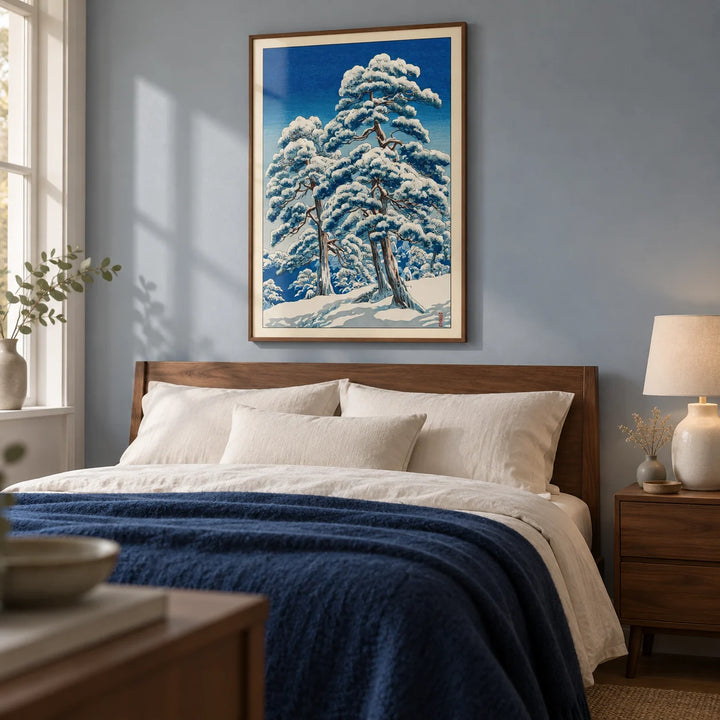 Hasui Kawase Winter Landscape Print, framed on the wall of a peaceful main bedroom in a UK home with a pale blue-grey wall and simple walnut furniture