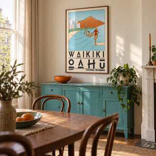 Hawaii Travel Poster, framed on the wall of a characterful dining room in a UK Victorian flat with warm ivory walls and a turquoise painted sideboard
