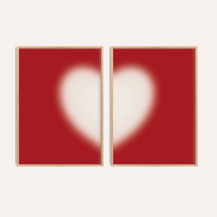 Heart wall art set of 2 with a soft cream heart split across two cherry red prints