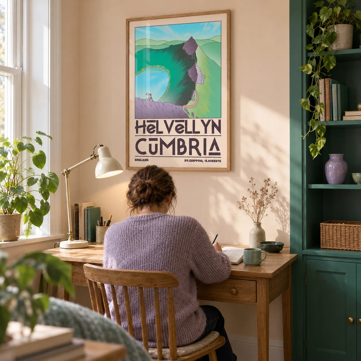 Helvellyn Cumbria Wall Art, framed on the wall of a quiet home study in a UK terrace with a pale peach wall and a built-in emerald cupboard