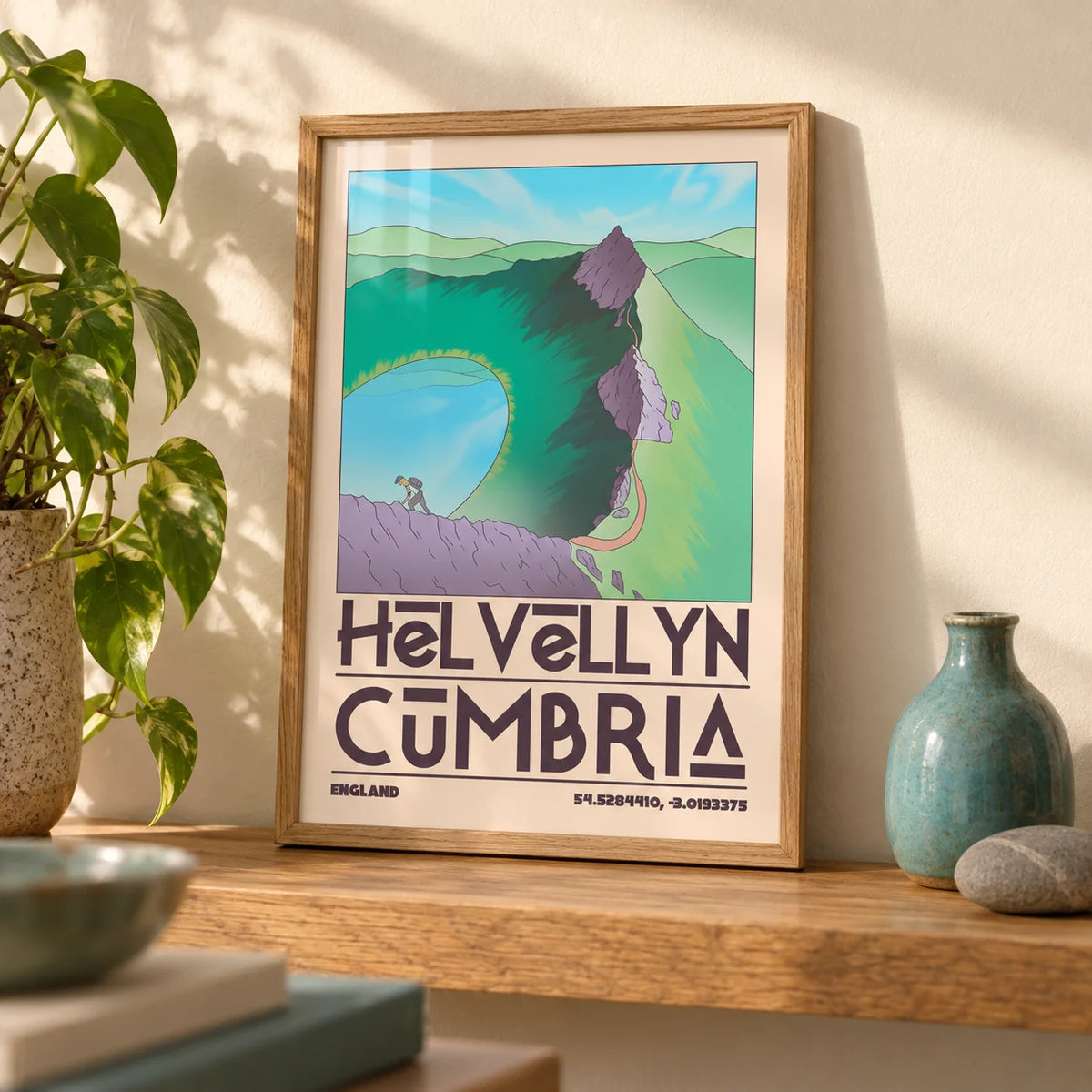 Helvellyn Cumbria Wall Art, a small A4 framed print leaning on an oak shelf in a living room