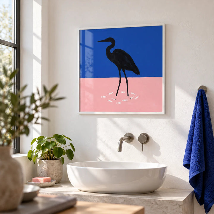 Heron Art Print, framed on the wall of a bright modern bathroom with a white plaster wall