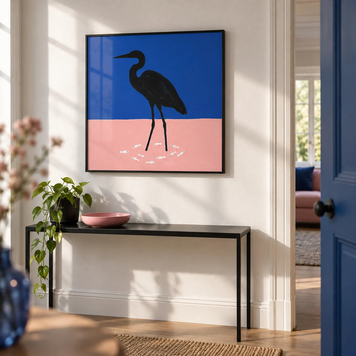 Heron Art Print, framed on the wall of a crisp hallway with a white wall