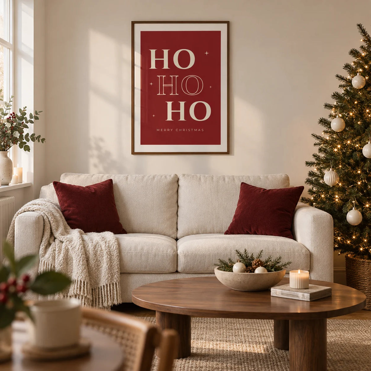 Ho Ho Ho Print, framed on the wall of a modern festive living room in a UK terraced home with warm white walls and a walnut floor