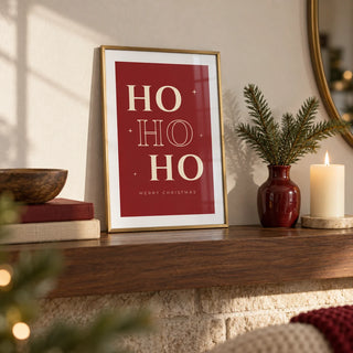 Ho Ho Ho Print, a small A4 framed print leaning on a walnut mantel shelf in a living room