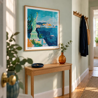 Holiday Posters, framed on the wall of a bright entrance hallway in a UK city flat with pale mint walls and warm timber floorboards